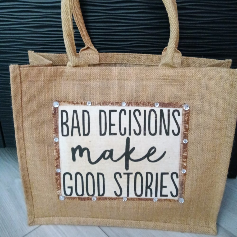 New jute tote embellished with a jewel trimmed saying "Bad Decisions Make"